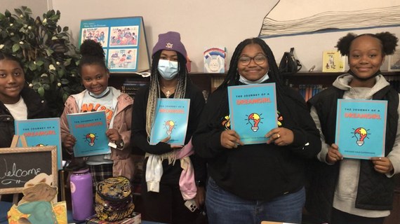 Dream Girls holding their Journey of a DreamGirl journals