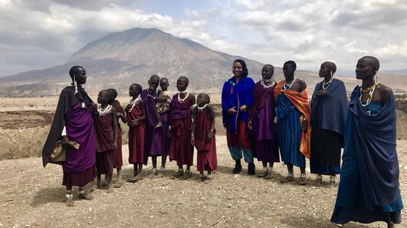 The International Empowerment Tour — students crocheting under a tent
