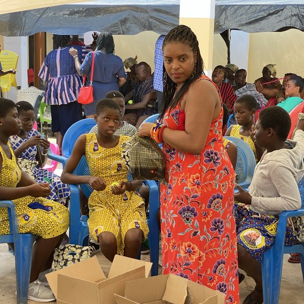 Our founder with young dreamers at an outdoor workshop in Ghana